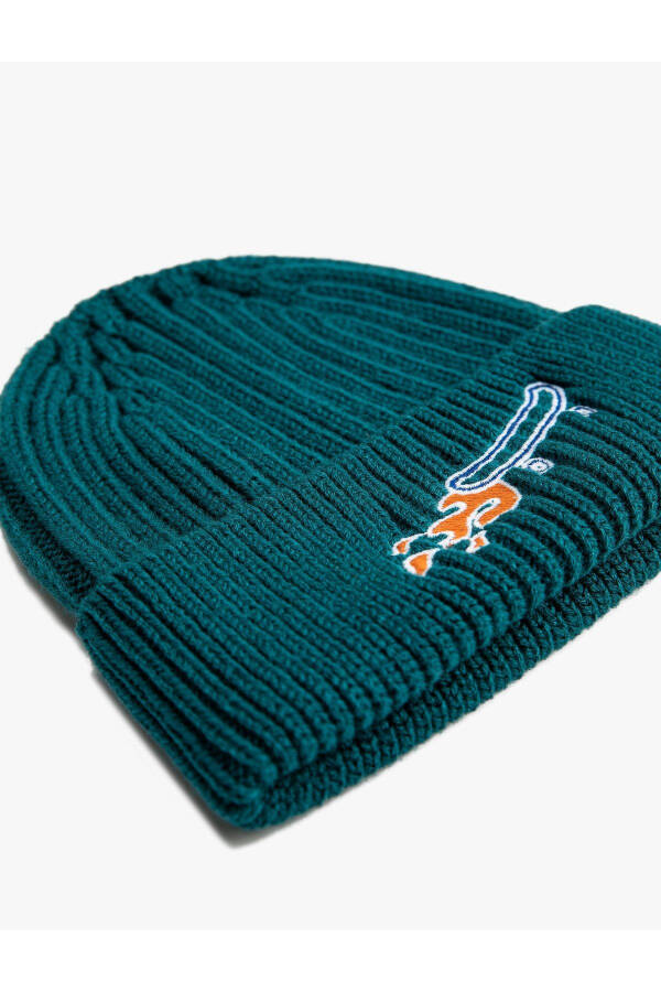 A cozy beanie with a stretchy knit. - 4