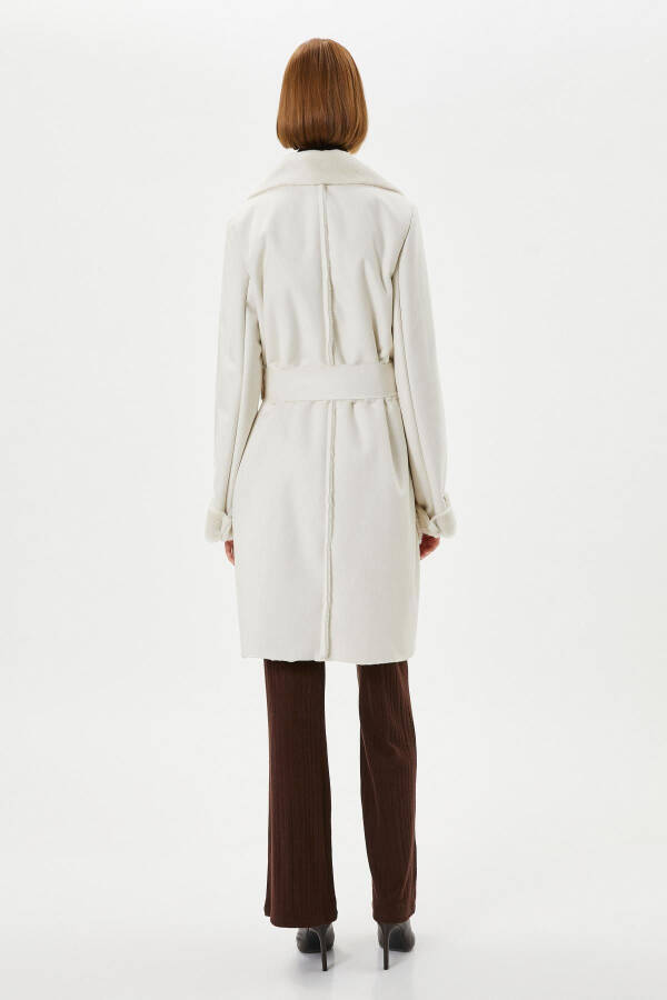 A white woman's coat - 4