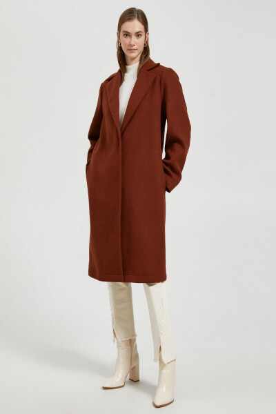 A woman's brown coat. - 3