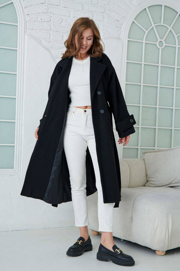 Black, belted, long coat with drop shoulders. - 7