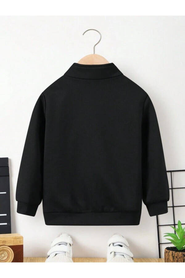 Black New York printed, stand-up collar, half-zip sweater. - 2