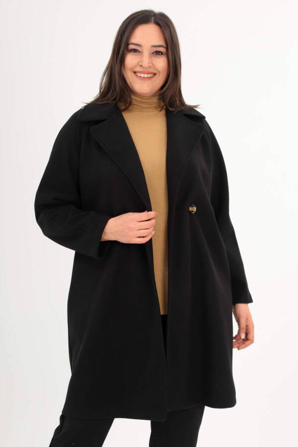 Black oversized coat with button details. - 3