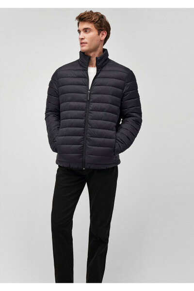 Black puffer jacket, stand-up collar. - 1