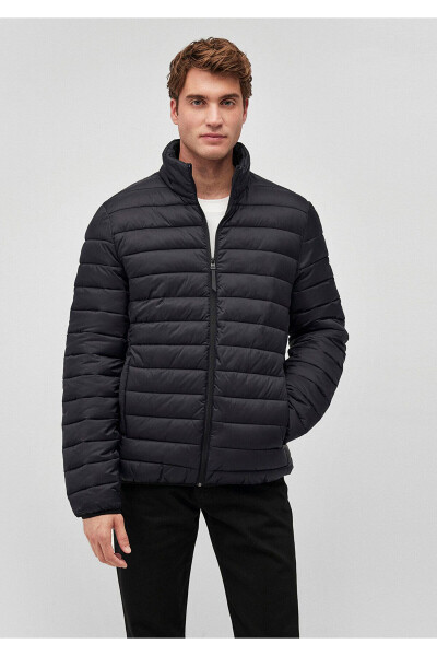 Black puffer jacket, stand-up collar. - 2