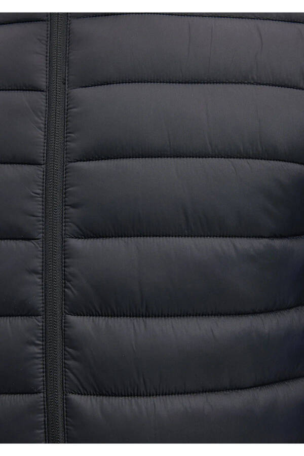 Black puffer jacket, stand-up collar. - 7