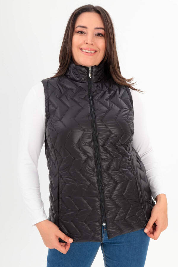 Black quilted vest with a zigzag pattern in plus size - 1