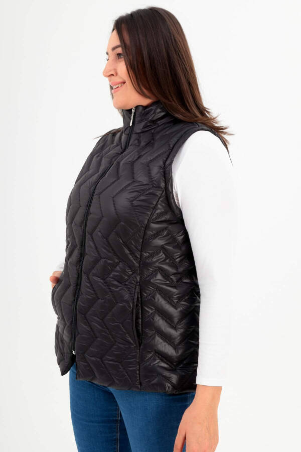 Black quilted vest with a zigzag pattern in plus size - 5