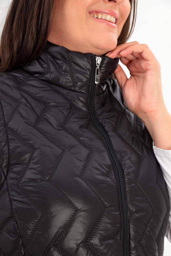 Black quilted vest with a zigzag pattern in plus size - 6