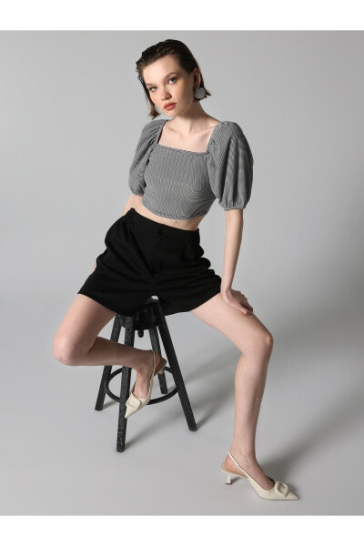 Black, short-sleeved, crop top with a square neckline and print. - 1