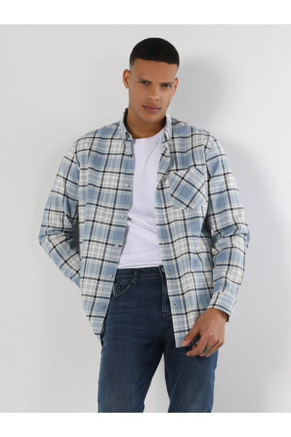 Blue, long-sleeved, regular fit men's shirt with a checkered pocket detail. - 1