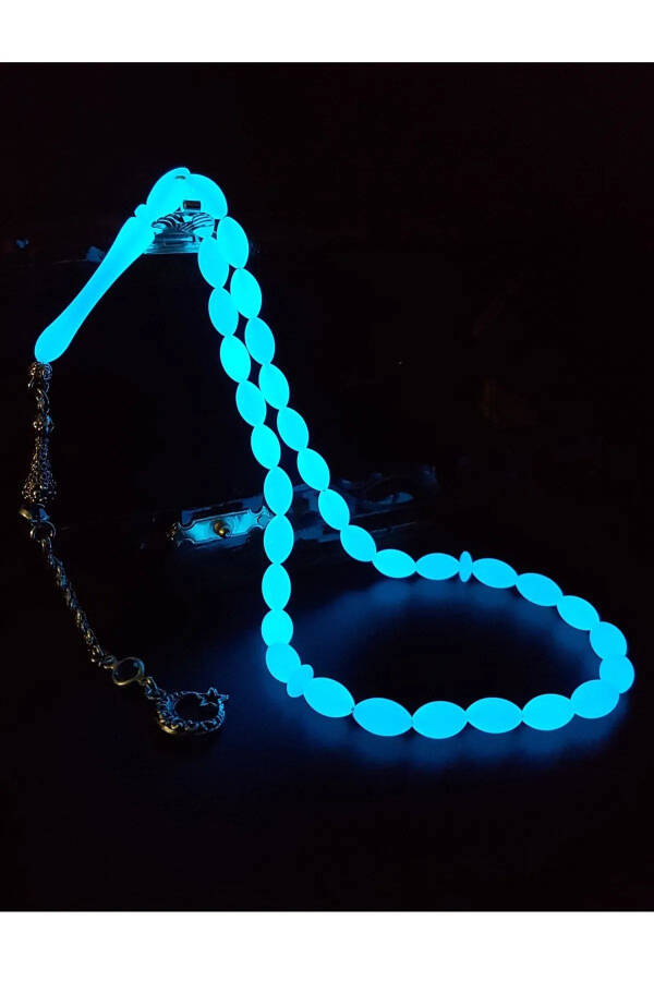 Blue phosphorescent barley cut cat's eye rosary. - 2