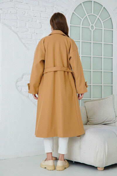 Double-breasted, buttoned, belted, long-sleeved, dropped shoulder, lined midi length camel coat. - 3