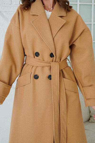 Double-breasted, buttoned, belted, long-sleeved, dropped shoulder, lined midi length camel coat. - 4