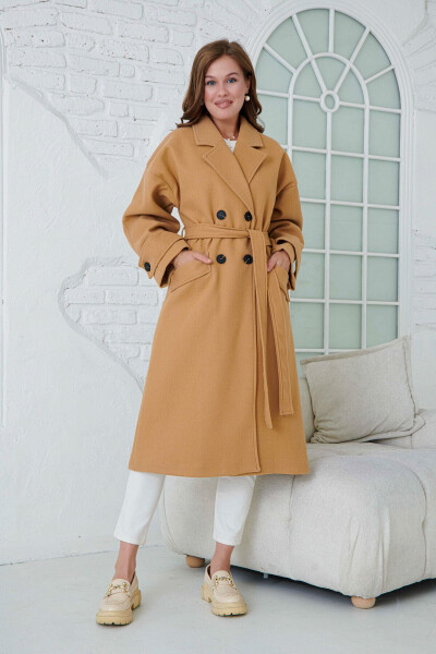 Double-breasted, buttoned, belted, long-sleeved, dropped shoulder, lined midi length camel coat. - 6