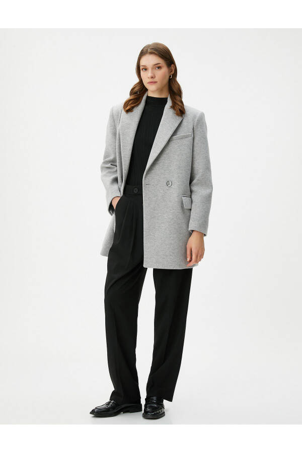 Double-breasted coat with buttoned pocket detail. - 9