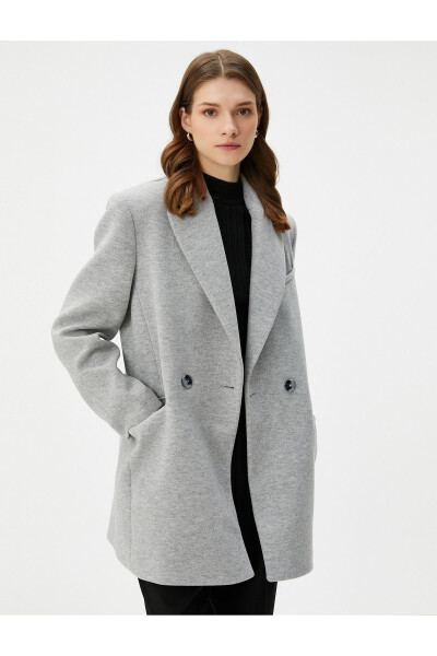 Double-breasted coat with buttoned pocket detail. - 10