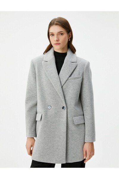 Double-breasted coat with buttoned pocket detail. - 11