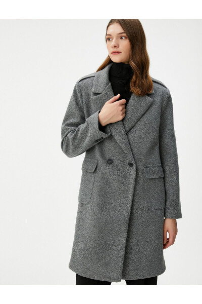 Double-breasted wool coat with buttoned flap pockets. - 8