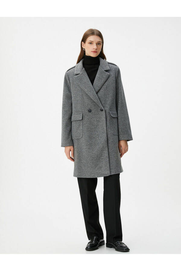 Double-breasted wool coat with buttoned flap pockets. - 9