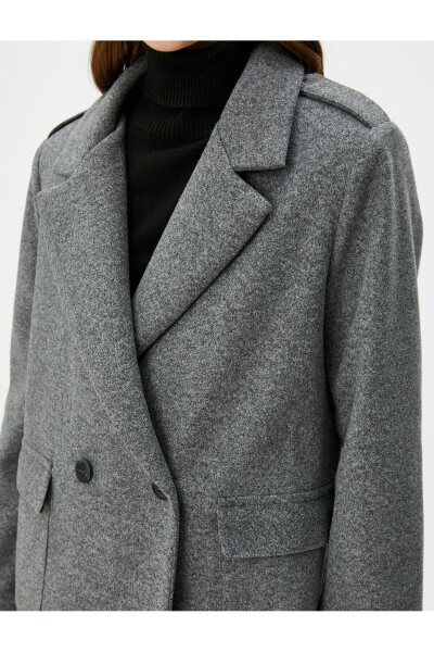 Double-breasted wool coat with buttoned flap pockets. - 11