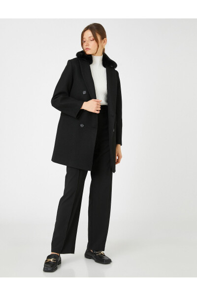 Double-breasted wool coat with plush details. - 2