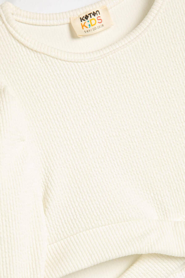 Ecru color, long-sleeved, crew neck crop top with window detail and ribbing. - 1