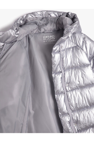 Girls' long puffer jacket with hood, filling, and zippered pockets. - 4