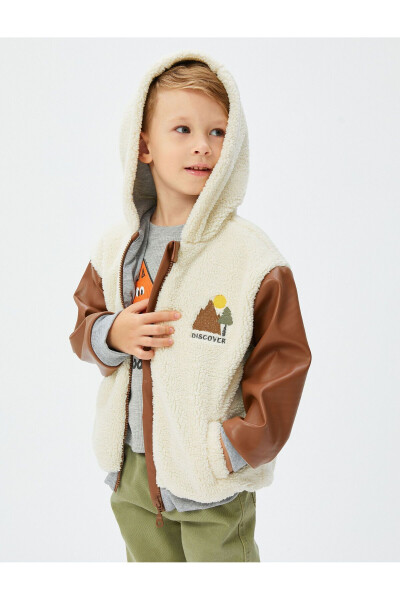 Hooded plush jacket with embroidered faux leather details. - 1