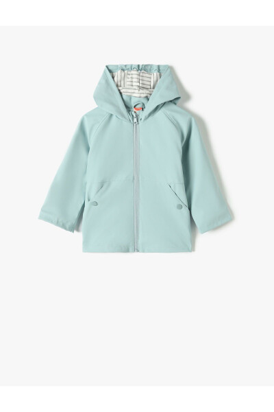 Hooded raincoat with zipper closure and pocket details. - 1