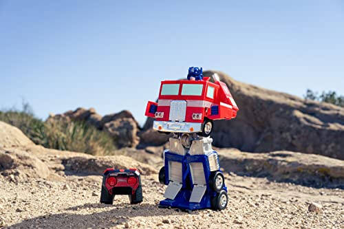 Jada Toys - Transformers Optimus Prime Konvertatsiya qiluvchi RC Avtomobil - Bolalar o'yinchoq sovg'asi - Yuk mashinasidan robotga o'zgarish - Chiroqlar va tovushlar - To'liq funksiyali masofadan boshqarish pulti - 13' Uzun - 3