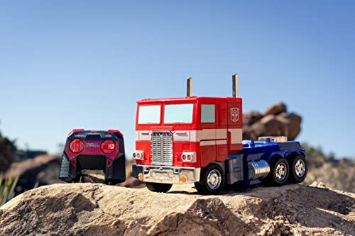 Jada Toys - Transformers Optimus Prime Konvertatsiya qiluvchi RC Avtomobil - Bolalar o'yinchoq sovg'asi - Yuk mashinasidan robotga o'zgarish - Chiroqlar va tovushlar - To'liq funksiyali masofadan boshqarish pulti - 13' Uzun - 4