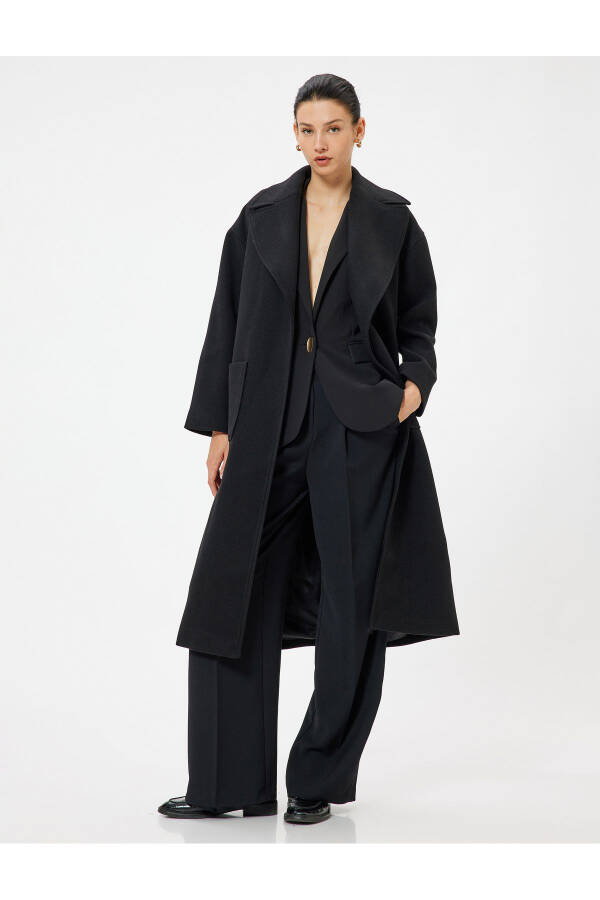 Long, double-breasted, belted cashmere coat. - 8