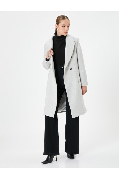 Long, double-breasted, buttoned pocket detail, belted wool coat. - 9