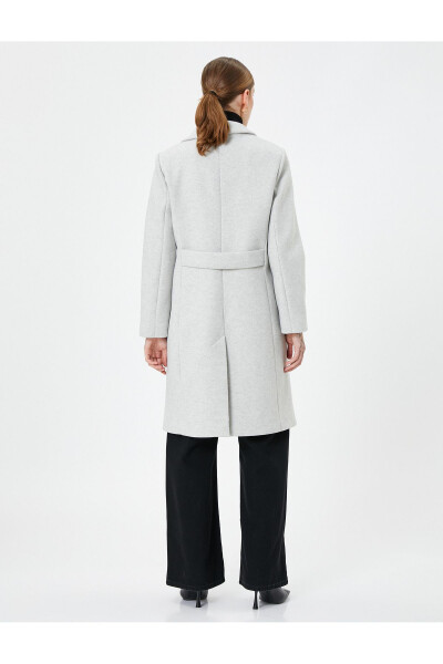 Long, double-breasted, buttoned pocket detail, belted wool coat. - 12