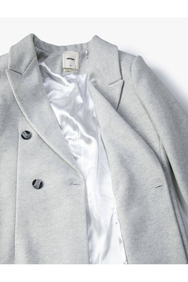 Long, double-breasted, buttoned pocket detail, belted wool coat. - 14