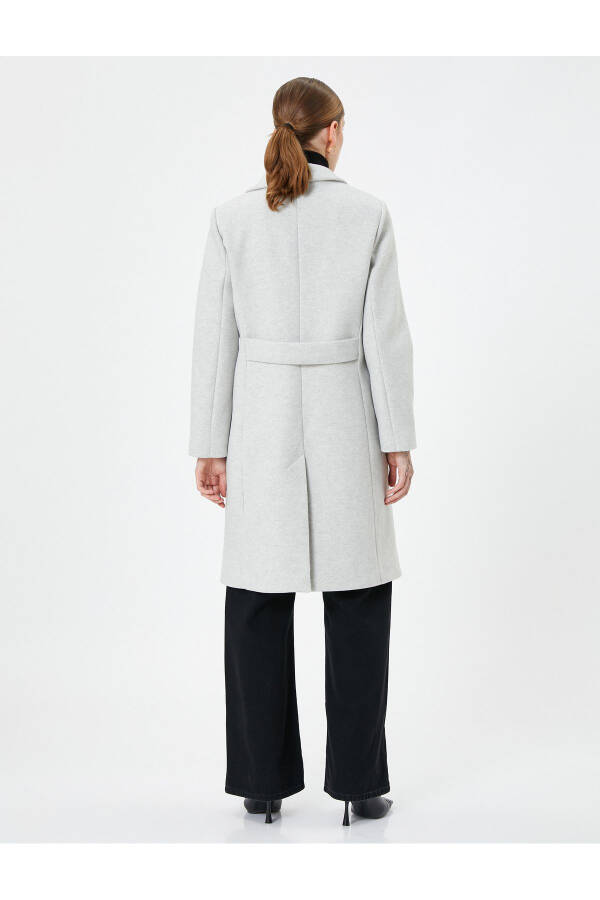 Long, double-breasted, buttoned pocket detail, belted wool coat. - 4