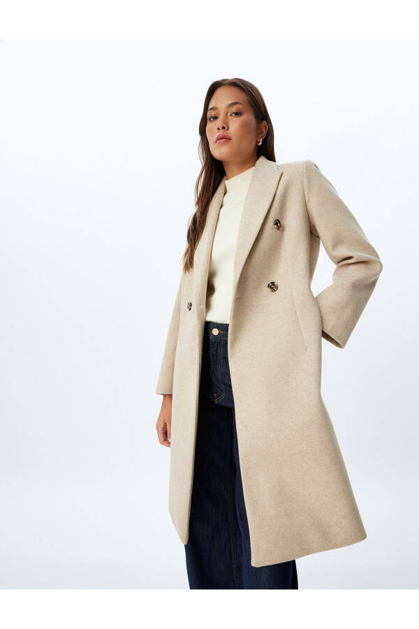 Long, wool coat. Featuring a crossover collar, hidden pockets and thick knit details. - 1