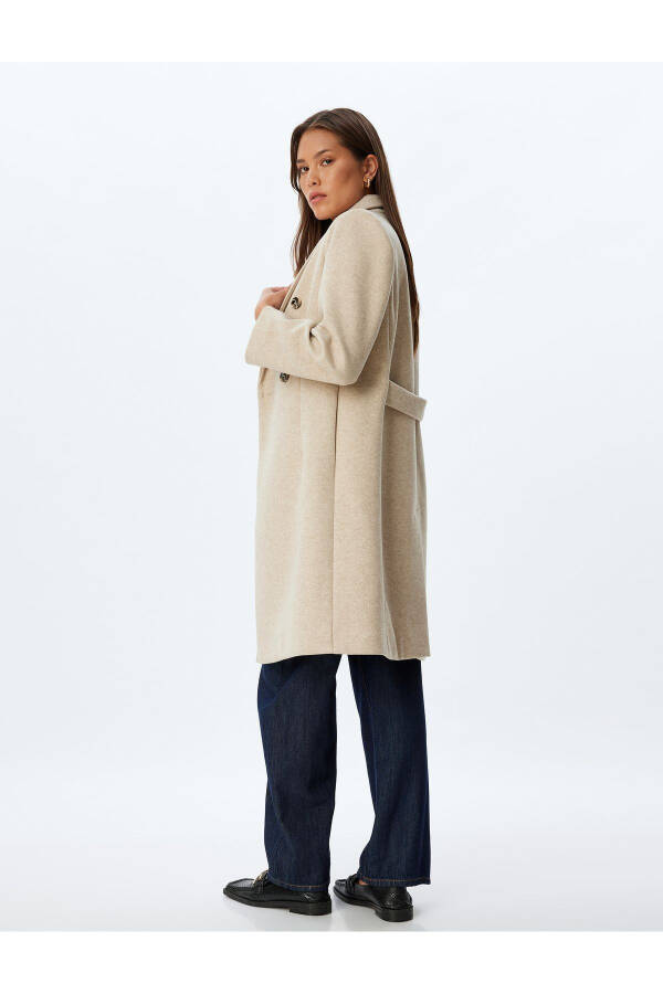 Long, wool coat. Featuring a crossover collar, hidden pockets and thick knit details. - 2