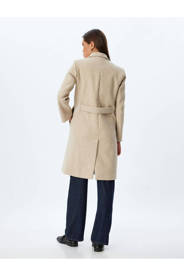 Long, wool coat. Featuring a crossover collar, hidden pockets and thick knit details. - 4