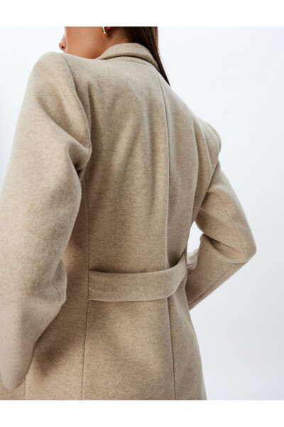 Long, wool coat. Featuring a crossover collar, hidden pockets and thick knit details. - 6