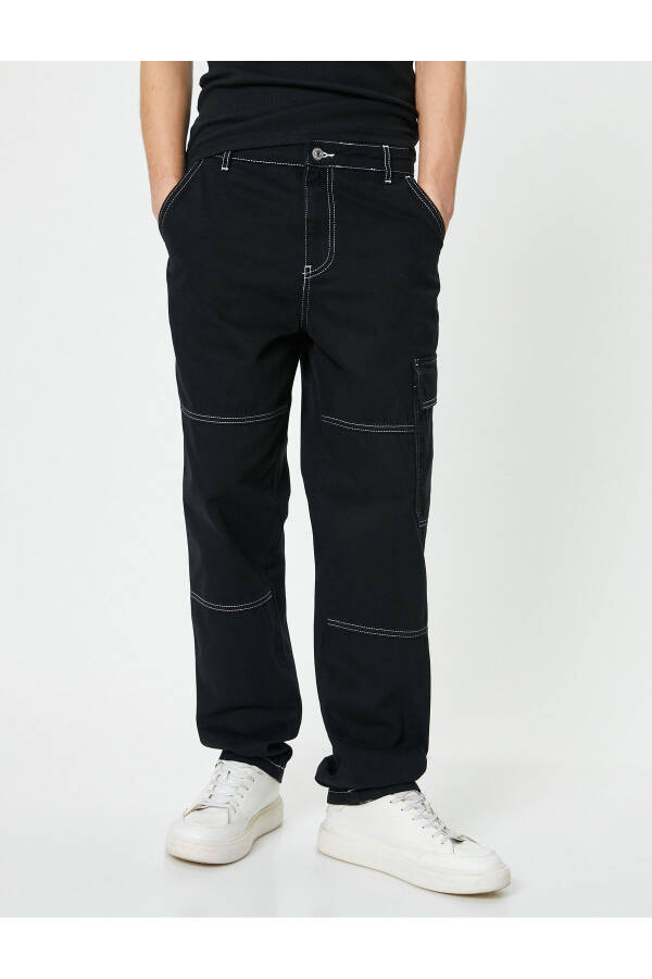 Oversized denim pants with cargo pockets, stitch detailing and buttons. - 10