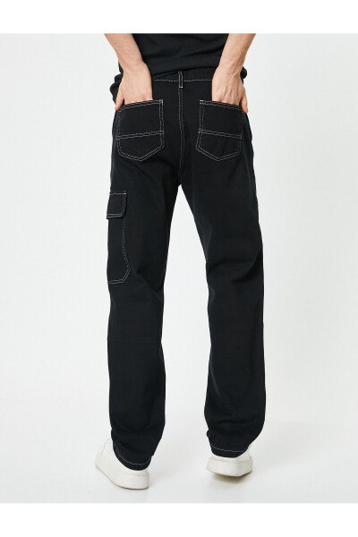 Oversized denim pants with cargo pockets, stitch detailing and buttons. - 12