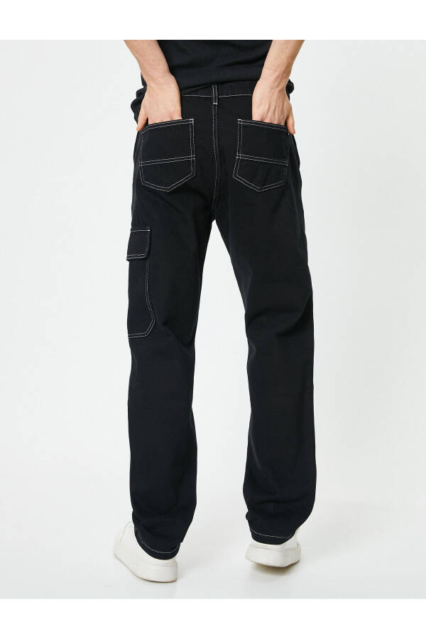 Oversized denim pants with cargo pockets, stitch detailing and buttons. - 12