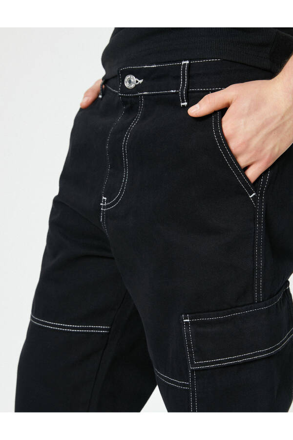 Oversized denim pants with cargo pockets, stitch detailing and buttons. - 13