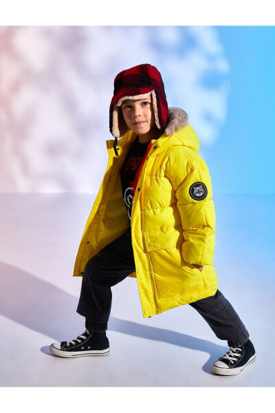 Padded hooded puffer jacket with faux fur detail pockets. - 1