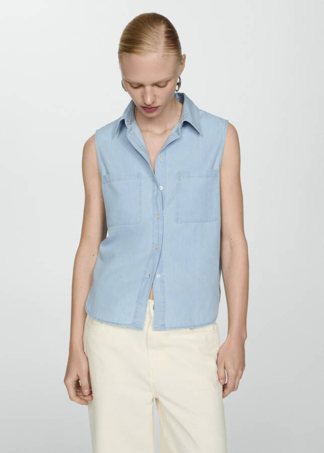 Sleeveless light blue denim shirt - 8