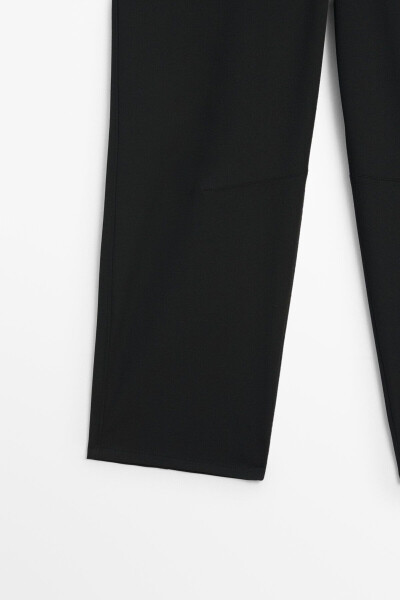 Slim fit, technical fabric trousers with a barrel leg. - 8