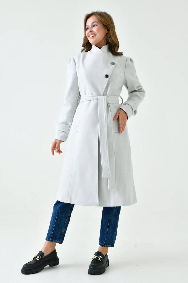 Stone-colored wool coat, buttoned, shawl collar, belted, lined, long sleeves. - 2