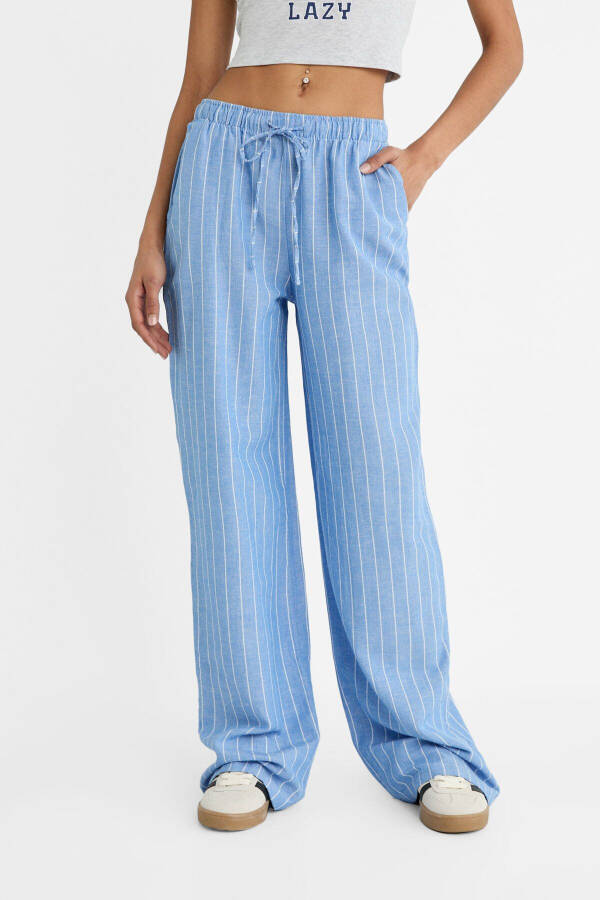 Striped relaxed fit linen blend trousers - 9