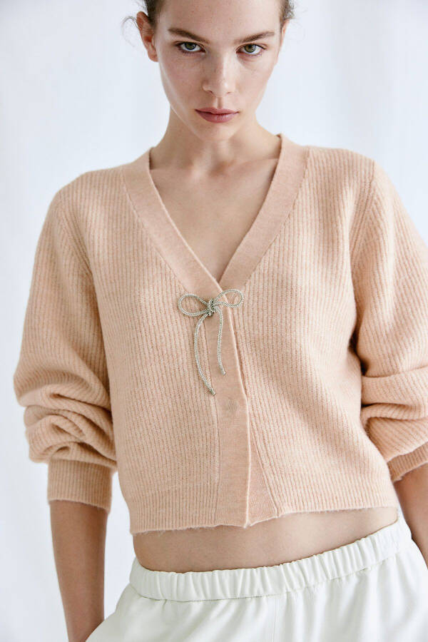 Sweater with faux diamond bow - 1